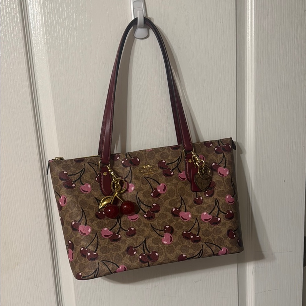 Coach Cherry comes with Cherry charm and 1 more key charm